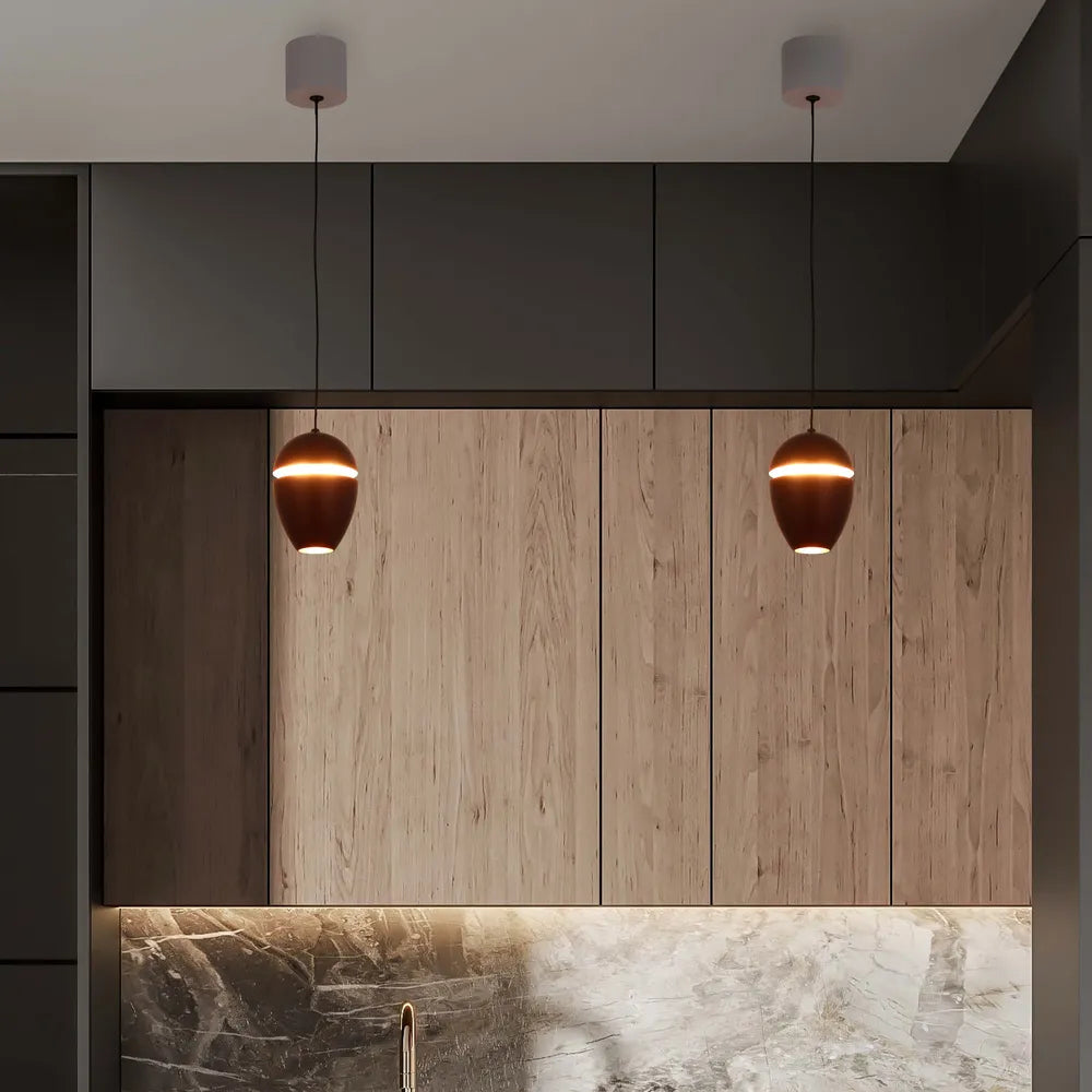 Sleek acorn LED pendant downlight illuminating a modern kitchen with warm white light, enhancing the chic decor and cove lighting effect.150-19072