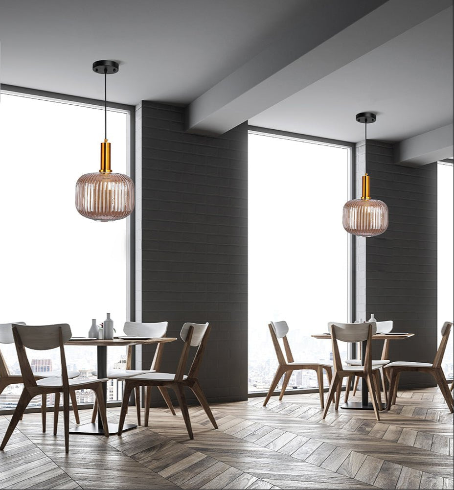 Golden bronze metal amber glass cylinder pendant light short with e27 fitting in indoor setting cafe table top