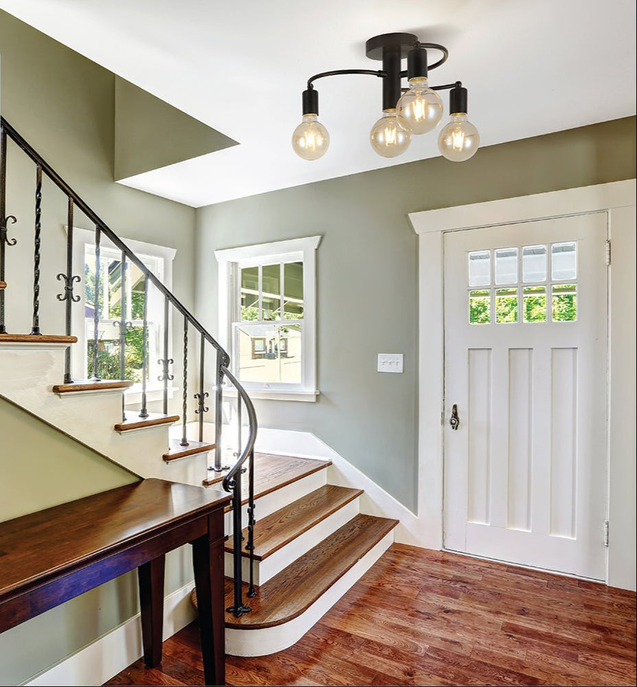 Black metal ceiling light with 4xe27 fitting in indoor setting hallway entrance