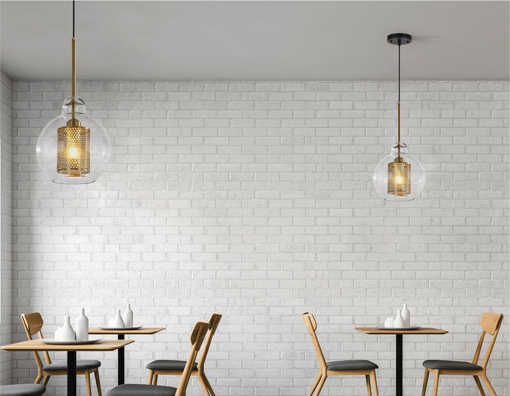 Golden metal clear glass globe pendant light with e27 fitting in indoor setting cafe restaurant