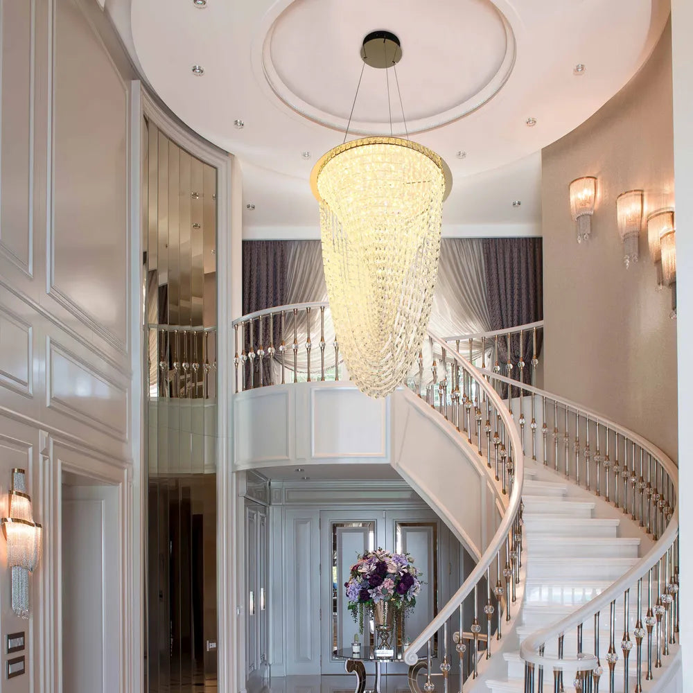 Elegant gold crystal chandelier in a modern dining room, providing sophisticated lighting to enhance stylish decor.159-18344